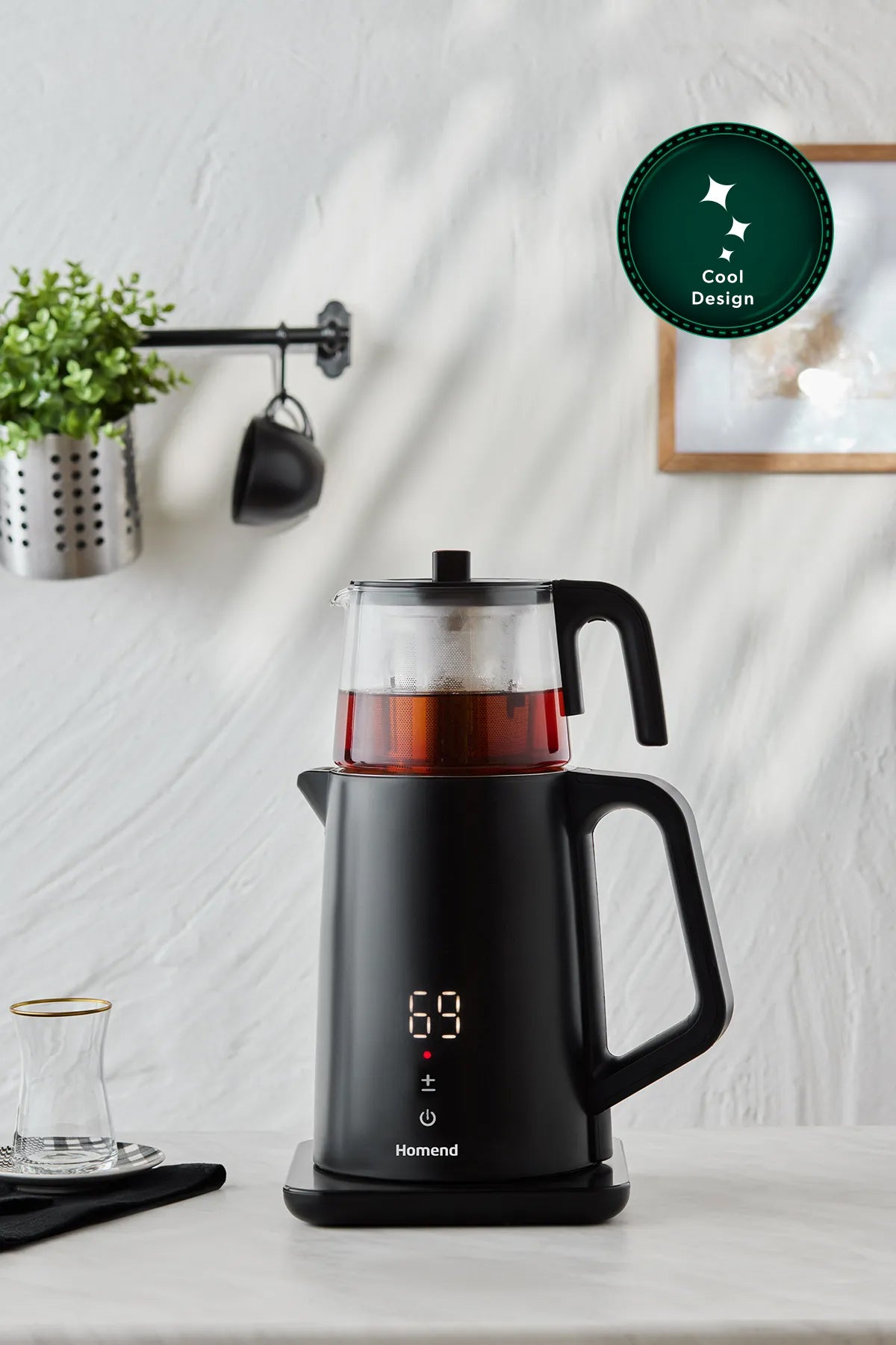 Tea machine consist of 5 parts, the main parts are the kettle stainless stainless steel double layered cooltouch body and the glass tea tea pot part. The  the cover of can be used both on the tea pot glass and the kettle part separetely. the glass tea pot part has a stainless steel brew infuser inside this part is attachable and detachable. Under the kettle the electric mechanism, cable connects to the plug. The overall product has a cool design and modern sleek look as well as the functionality.